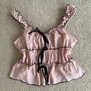 Vintage pink ruffle top with black trim and bow detail - size S